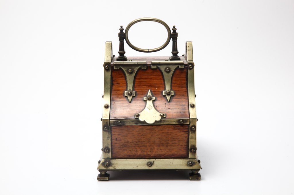 19th C. Brass Mounted Gothic Burlwood Caddy: 19th century Gothic style brass mounted burlwood caddy with brass interior, the lift top stamped "29 4 Ro EW" within a diamond, the whole rising on four square feet. 7" H x 6.5" W x 4.75" D.