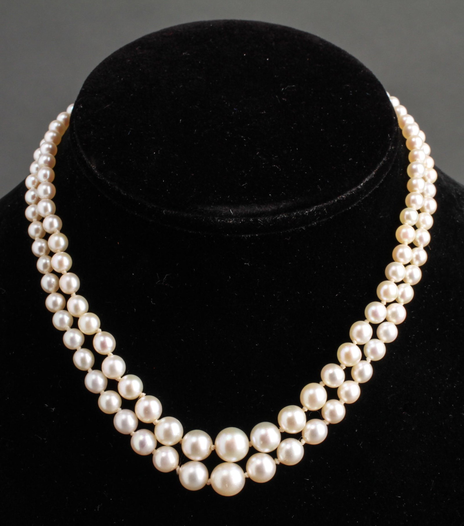14K Gold Double Strand Graduated Pearls Necklace: 14K white gold clasp double strand graduated pearls choker / necklace, approx: 4mm to 8mm diameter pearls. 14" L. Gold not weighable.