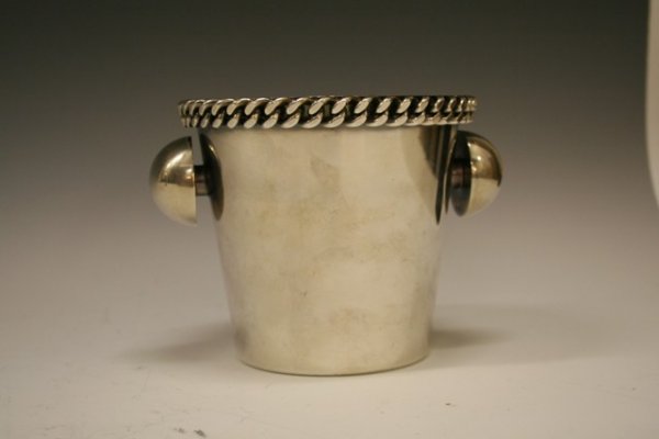 Rare Jean Despres Silver Plate Wine Bottle Bucket: Rare Jean Despres Silver Plate Wine Bottle Bucket. This wine bucket is listed in the Despres Book. This wine bucket measures 5" in height, 5.5" in diameter on top and 3 3/4" diameter on bottom.