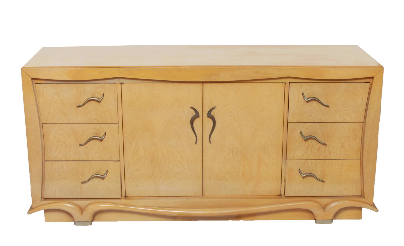 Modern Blonde Wood Dresser / Commode: Modern blonde wood dresser / commode with two central cabinet doors revealing three drawers, flanked on either side by sets of three drawers, curvilinear metal pulls. 34" H x 74" W x 22" D. Minor spli