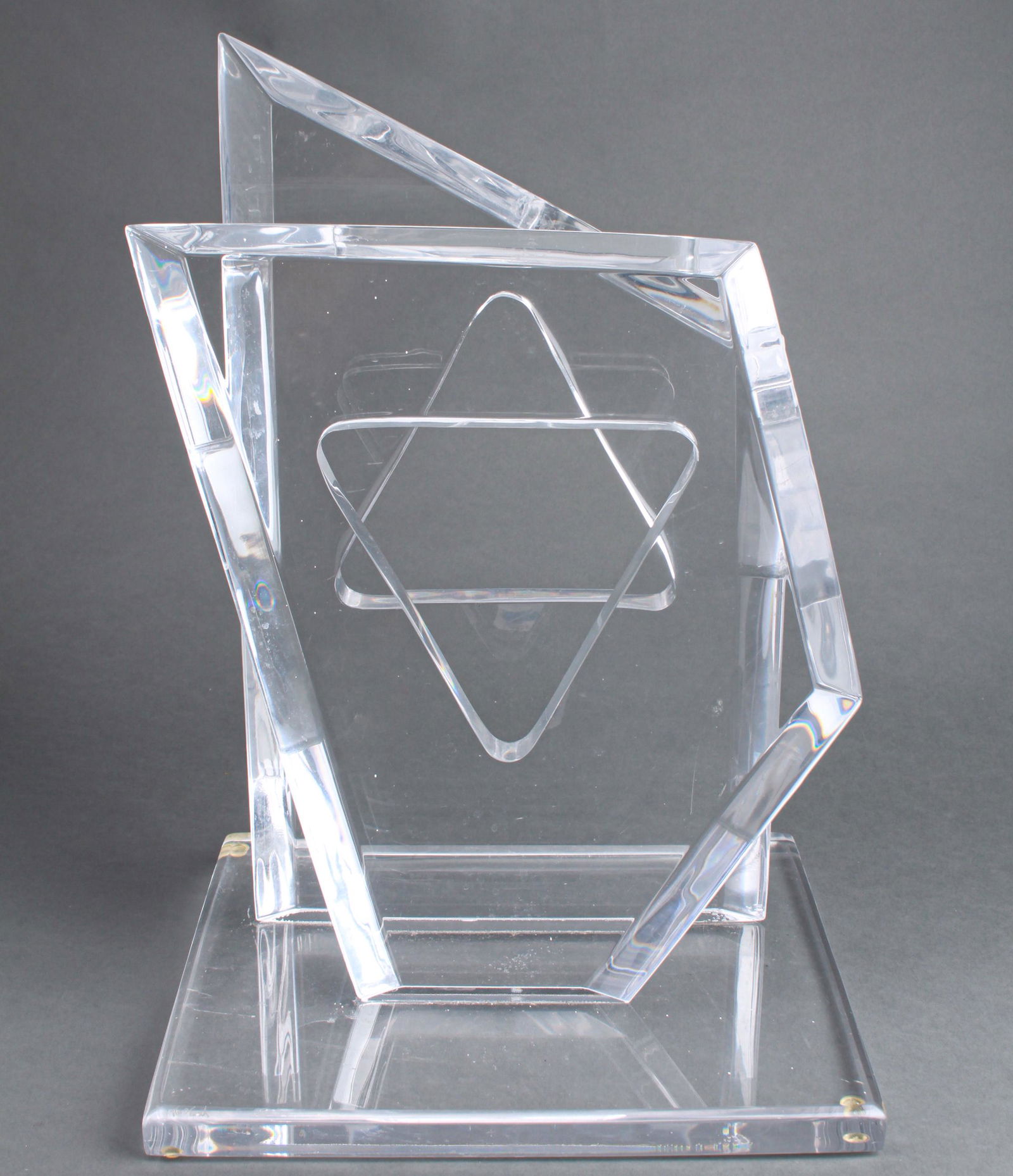 Hivo Van Teal Judaica Star of David Modern Lucite: Hivo van Teal (20th century) "Star of David" modern lucite / acrylic sculpture, two shaped vertical slabs with triangle cutouts mounted to rectangular base, signed at corner "Van Teal." 20" H x 13.5"