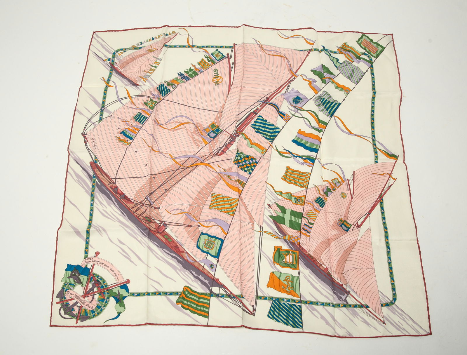 Hermes "Claque au Vent" Silk Scarf: Hermes silk scarf, "Claque au Vent," designed by Dominik Jarlegant, pink boat sails and flags on white, signed "Hermes Paris." 25" square.