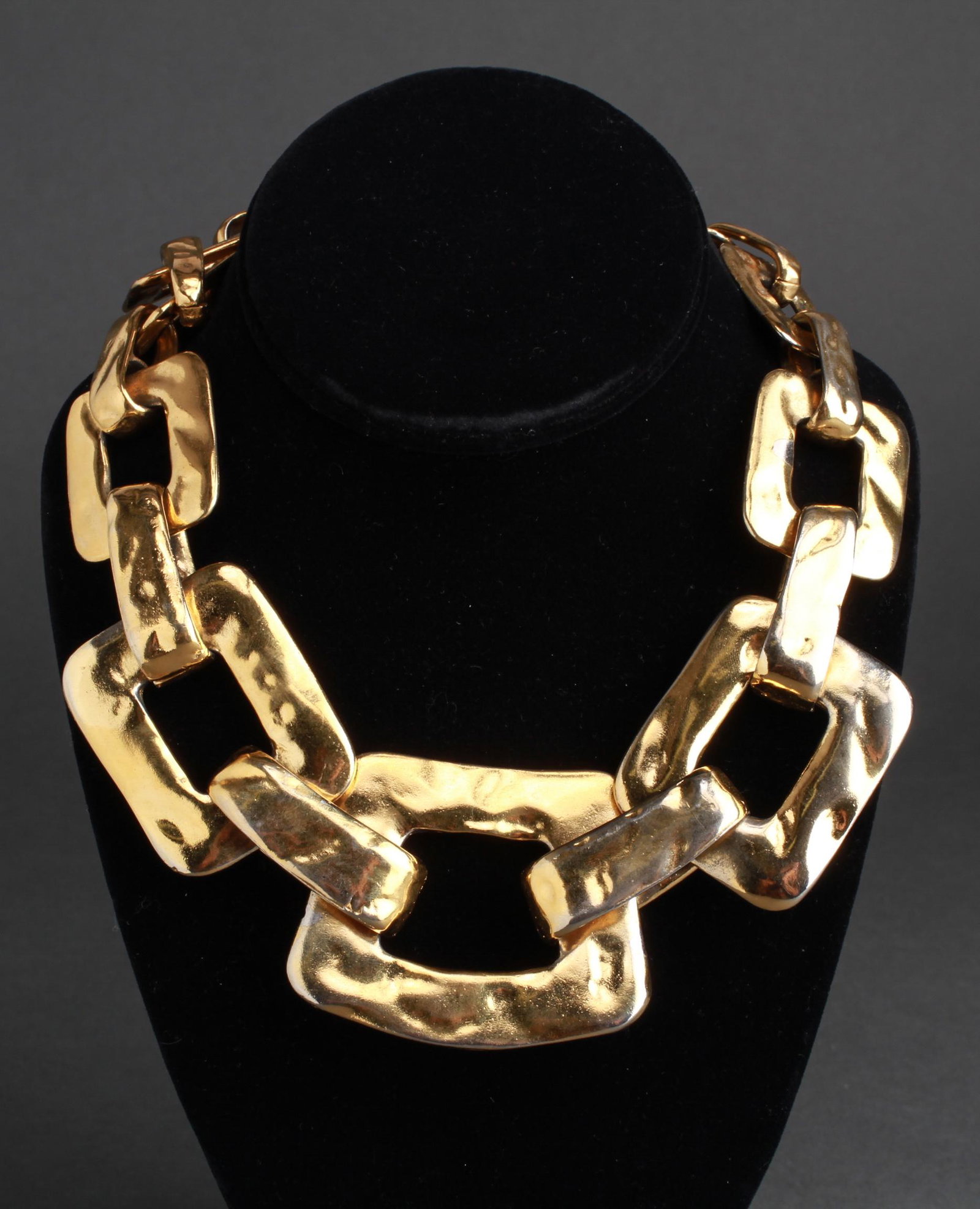 Yves Saint Laurent Gold-Tone Hammered Choker: Yves Saint Laurent gold-tone hammered choker necklace, marked: "Yves Saint Laurent," with edition number 264 / 425. 18.25" L.
