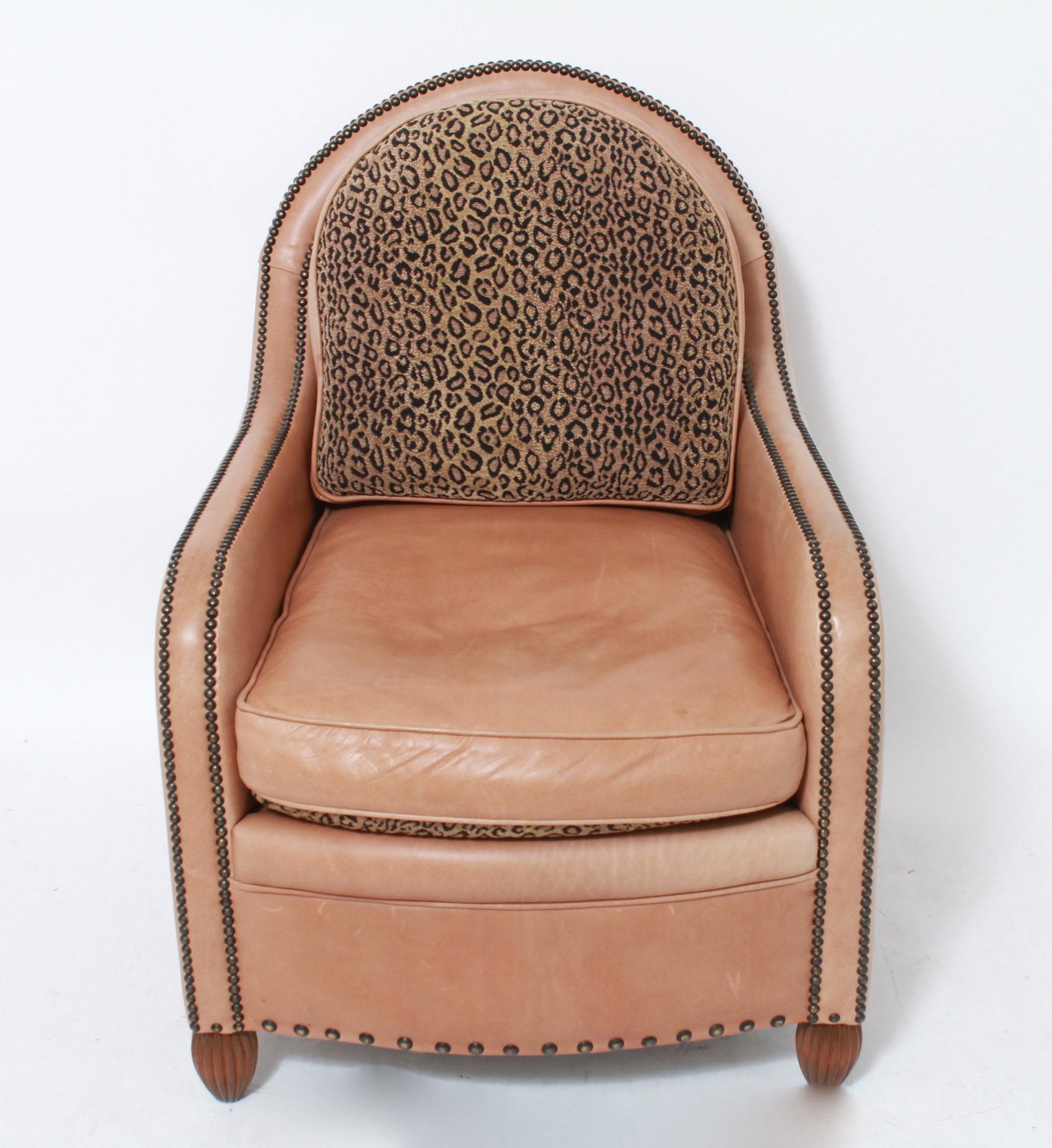 Art Deco Style Leather Lounge Chair: Art Deco style lounge chair with brown leather upholstery and allover nailhead stud trim, label underside. 36.5" H x 27" W x 32" D.