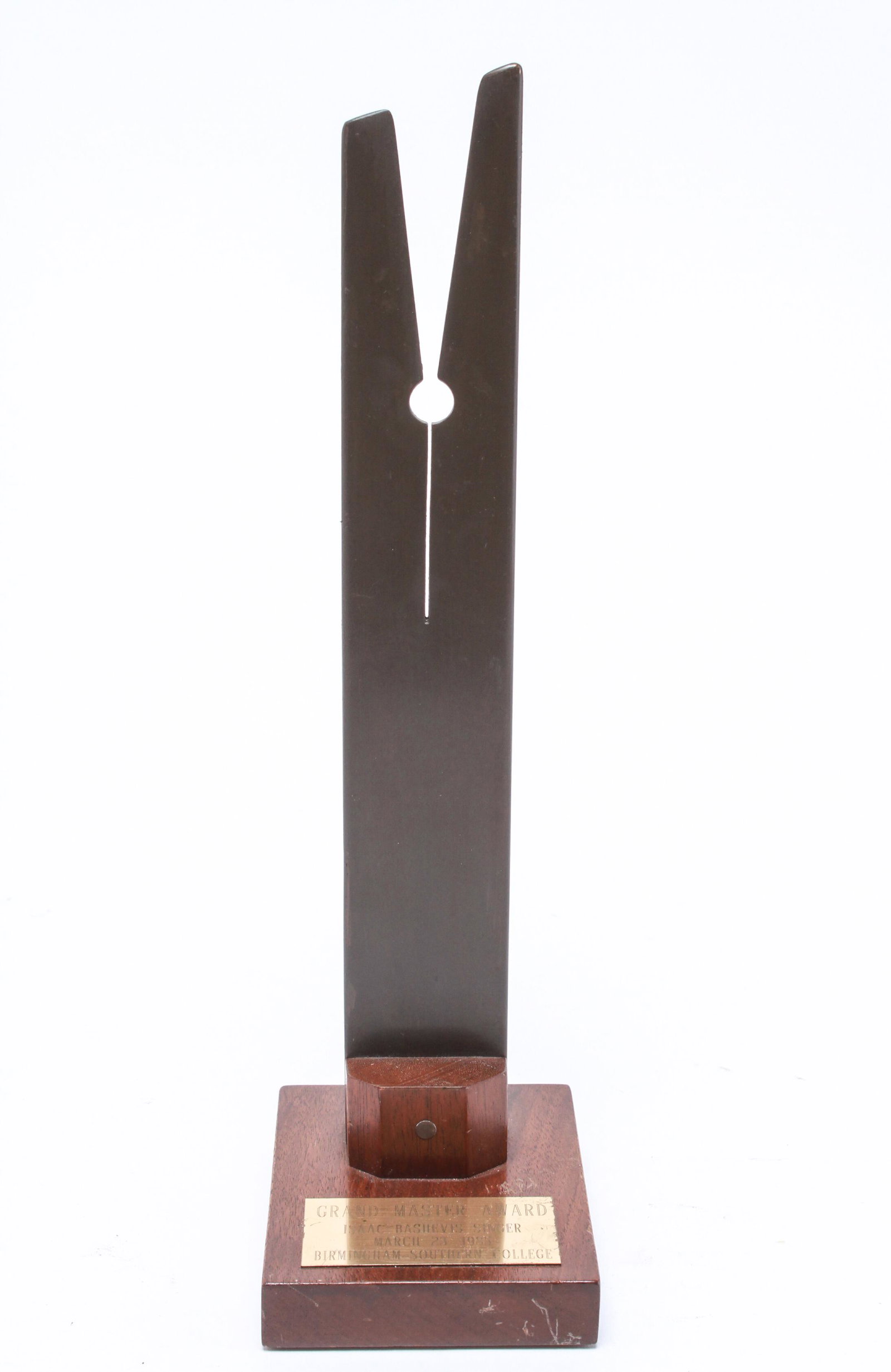 Isaac Bashevis Singer "Grand Master Award": "Grand Master Award" presented to Issac Bashevis Singer (Polish-American, 1902-1991), modern geometric sculpture mounted to wooden base, with plaque inscribed: "Grand Master Award / Issac Bashevis Sin