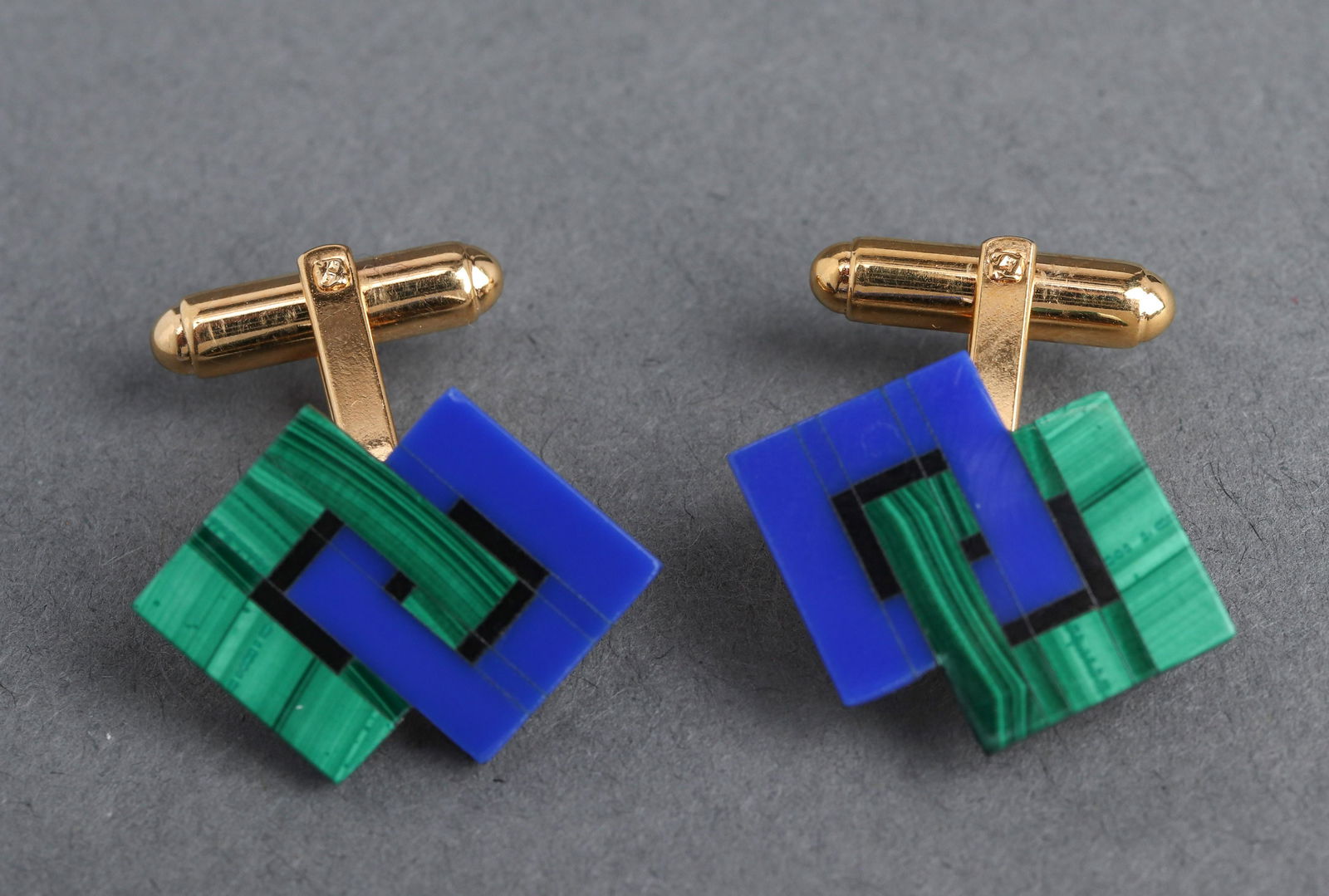 Malachite, Lapis & Onyx Inlay Cufflinks PR: Pair of costume yellow gold plated malachite, lapis and onyx inlay cufflinks; stamped "Hayward." 0.875" L x 0.875" W x 0.625" H.