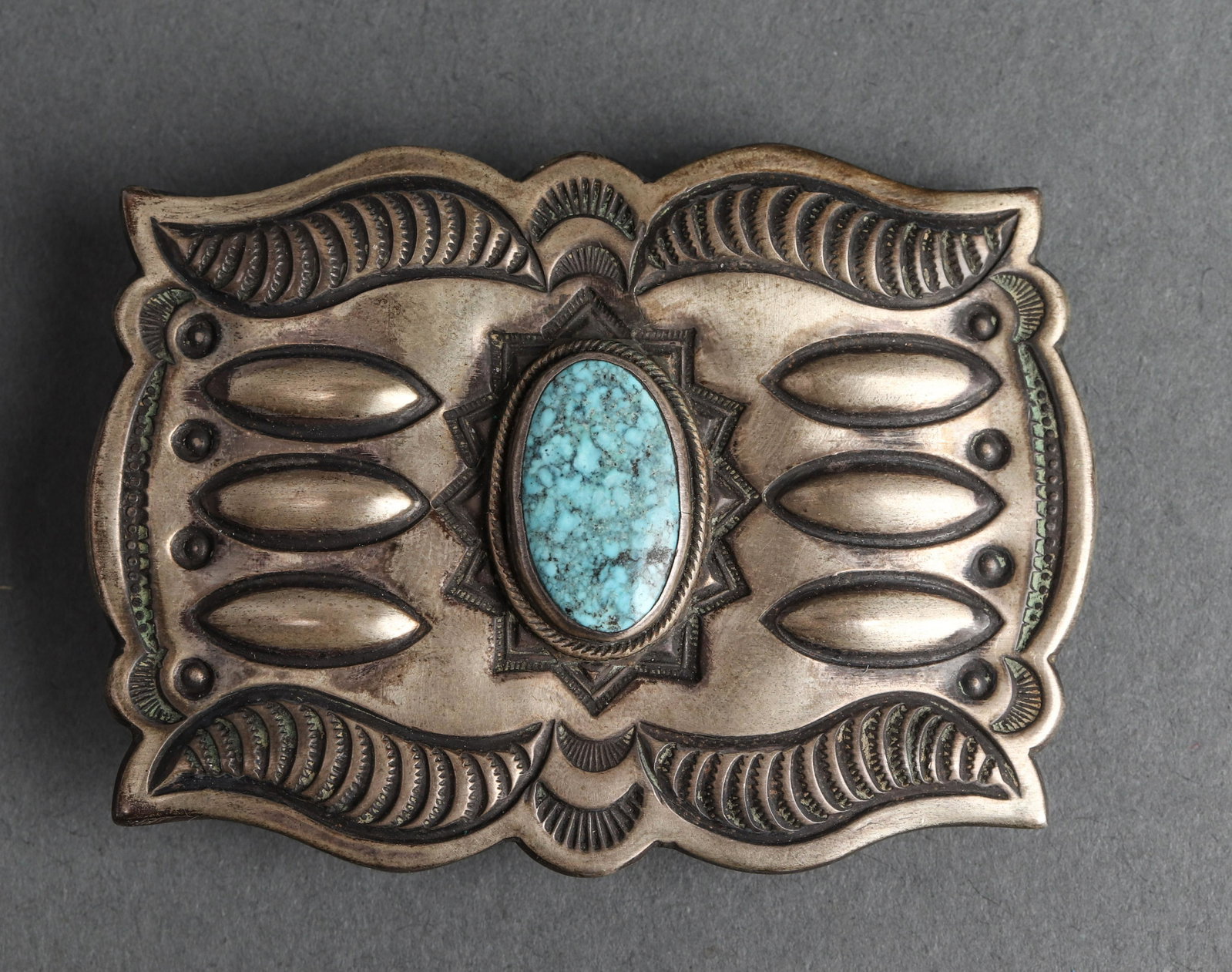 Native American Silver & Turquoise Belt Buckle: Native American silver and turquoise belt buckle. 2.875" L x 2" W, stamped: "STERLING W W". Turquoise: 20mm x 11mm. Approx. 1.55 ozt inclusive.