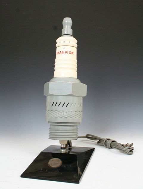 Champion Spark Plugs Promo Radio: Champion Spark Plugs AM promo radio. Serial number; 5770.Tested. 14 1/4", base; 8 1/2" x 5". Please note that there is some scuffing along the base.