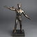 Cast Metal Man Balancing on Ball Figural Sculpture