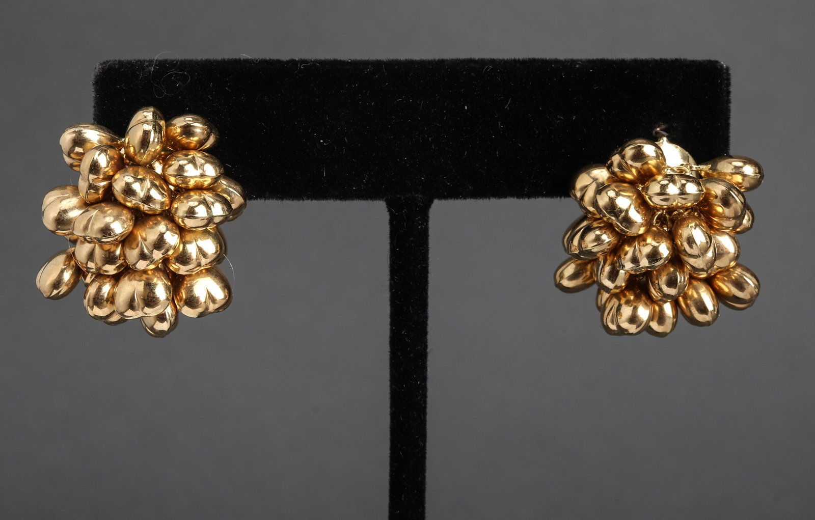 Italian 18K Yellow Gold Heart Cluster Earrings: Italian 18K yellow gold puff heart-motif cluster earrings with omega post backs, marked: "750 / 314 / VT / ITALY" with maker's mark. 1.0" L x 0.75" W x 0.75" H. Approx: 11.4 dwt.