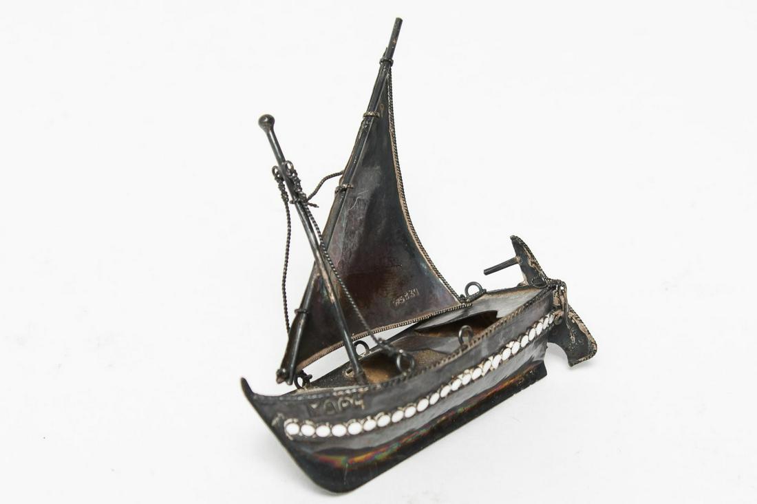 Greek Sterling Silver & Enamel Sailboat: Vintage Greek sterling silver single-sail boat with moving sail and tiller, the sides inset with enamel dot, the name "Hydra" in Greek applied to the sides. 2.75" L. Approx. 0.93 ozt.