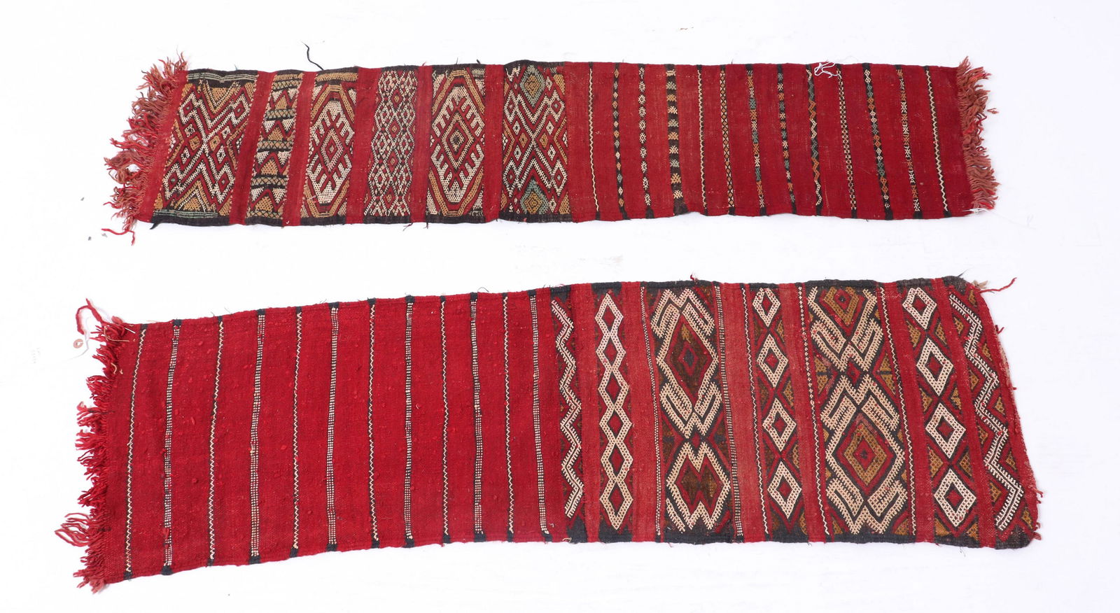 Southwestern Wool Table Runners / Hangings, 2: Two Southwestern / Native American manner wool table runners or wall hangings, both red with geometric motifs. Larger: 51" L x 15" W.