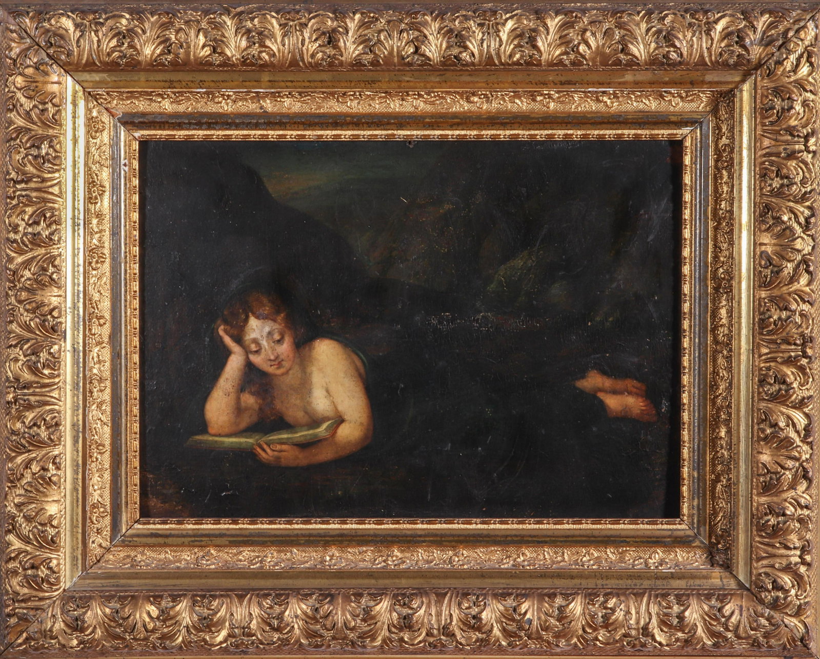 Woman Reading in Dark Landscape Oil on Panel: Antique oil on panel "Reclining woman reading in landscape," depicting a nude blanket-covered in dark rocky setting, in gilt carved frame, partial illegible label and seal on reverse. Image: 11" H x 1