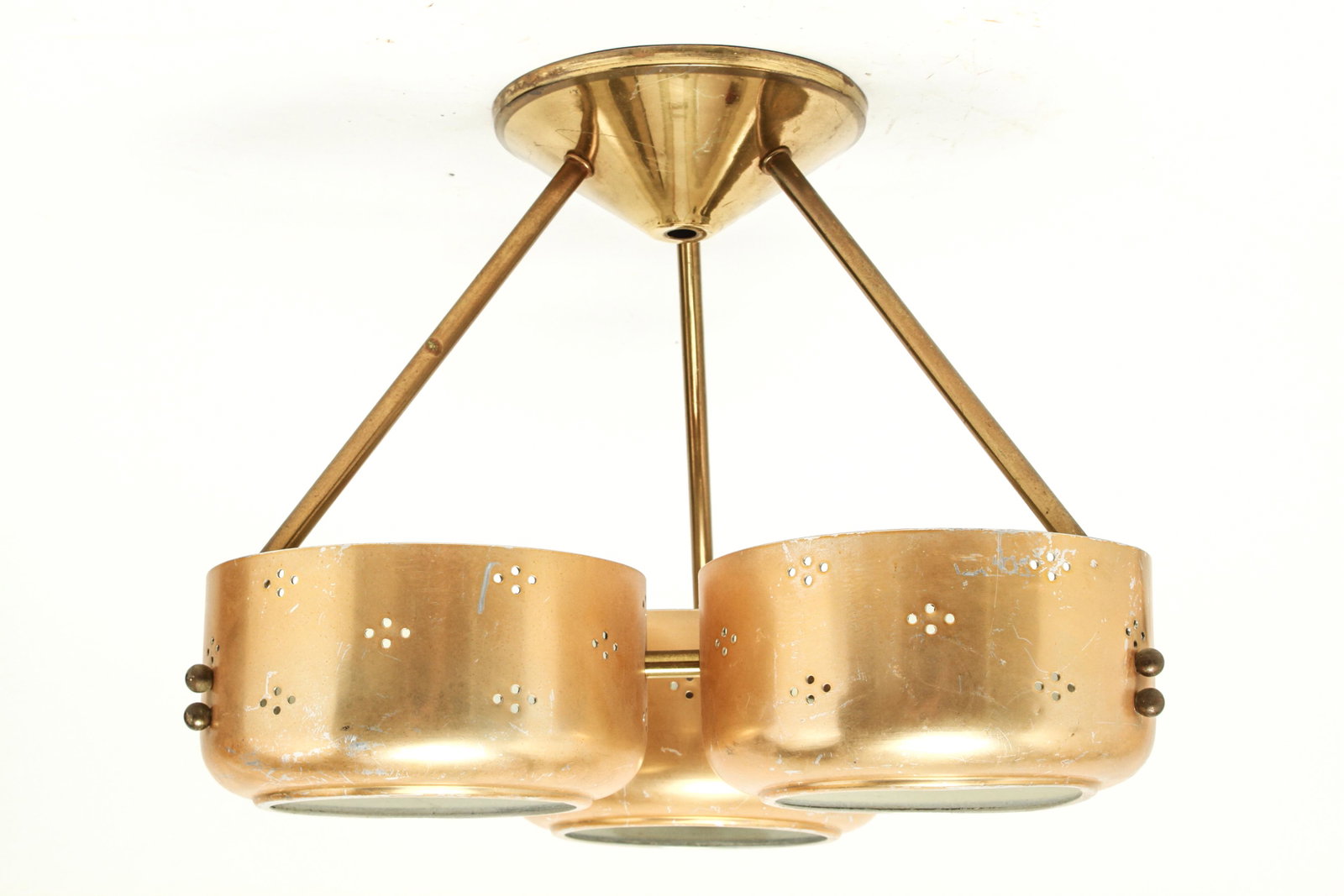 Mid-Century Perforated Metal Triple Chandelier: Mid-century modern chandelier with three circular perforated gilt metal shades in the manner of Paavo Tynell or Innolux Oy, on fixed tripod metal frame. 10.5" H x 12.5" W.