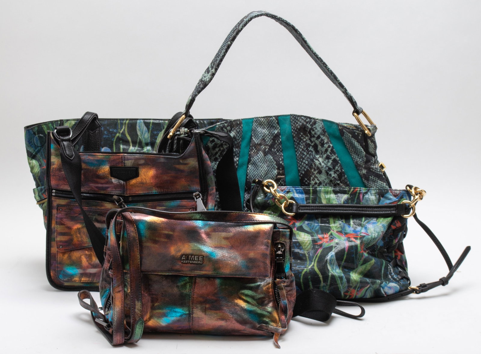 Aimee Kestenberg Handbags, Group of 5: Group of five Aimee Kestenberg bags, of jungle, shimmer, and snake print motif. Largest 15” H x 17” W x 2” D.