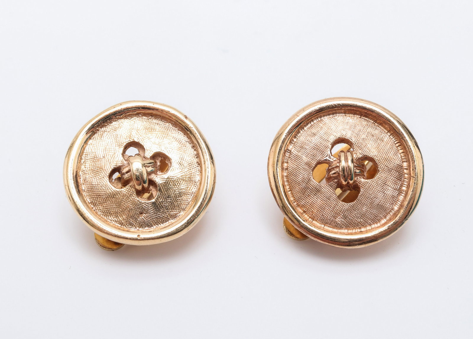 Vintage 14K & 10K Yellow Gold Button Clip Earrings: Vintage 14K yellow gold and 10K yellow gold button motif high polish and florentine finish earrings with omega clip backs, marked: "14K / 585 / 10K / 585" with maker's mark. 0.625" L x 0.625" W. Appro