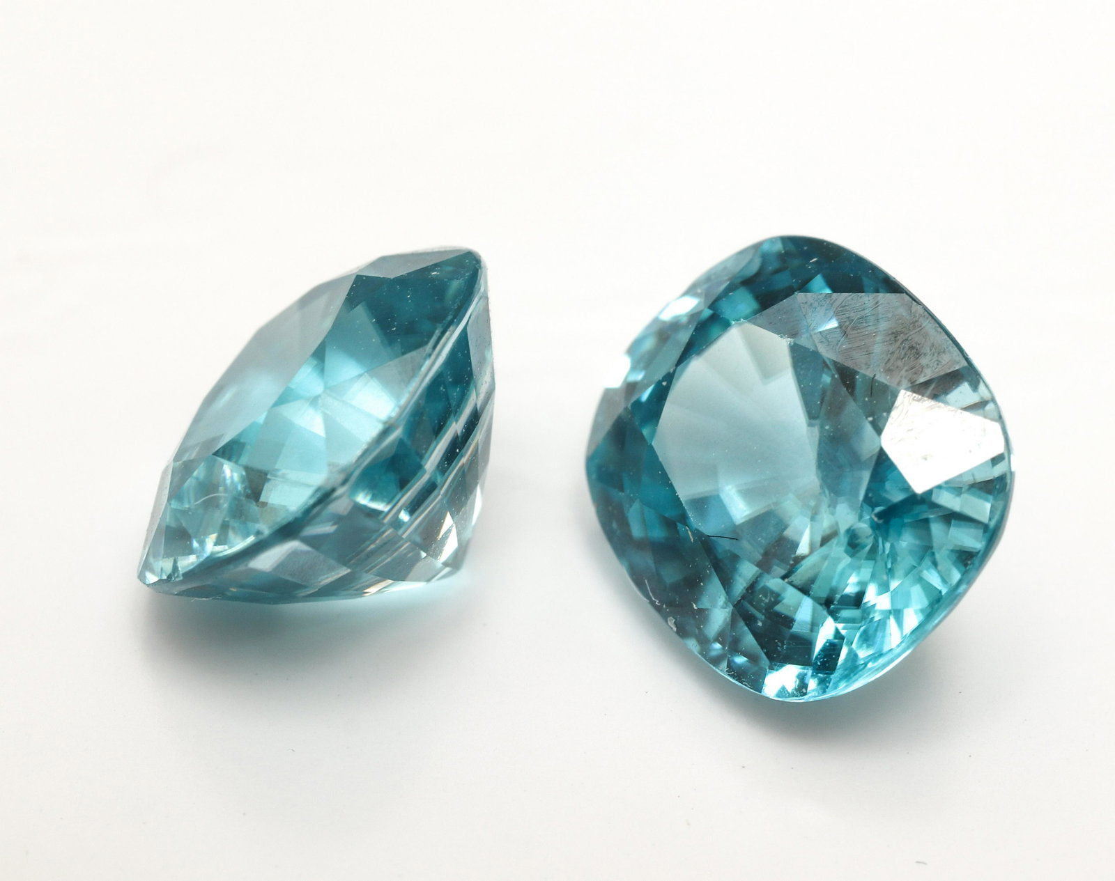 8.20cts. Loose Cushion-Cut Blue Zircon Stones, Pr.: Pair of loose 8.20cts. (carat total weight) cushion-cut faceted blue zircon stones. Approx: 9 x 8 x 6mm each. Good cut, minor abrasions to girdle of stones.