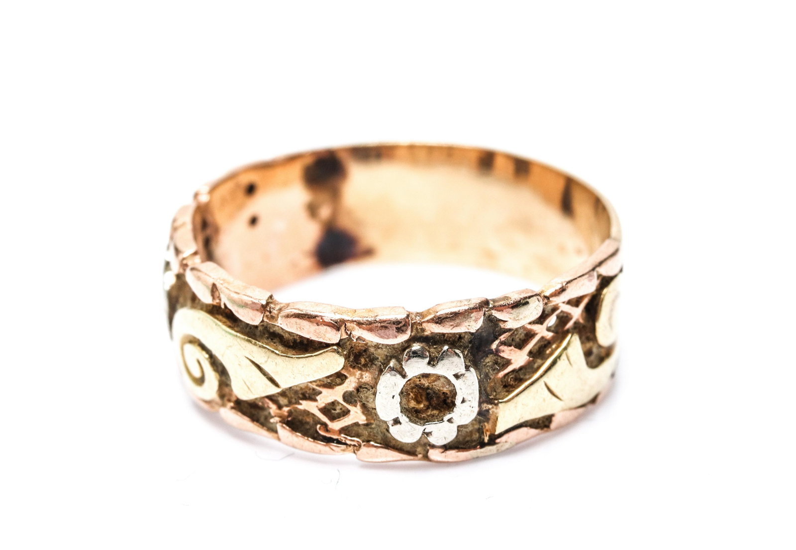 Edwardian 14K Tri-Gold Scroll & Floral Motif Ring: Edwardian 14K tri-tone gold: yellow gold, white gold and rose gold, scroll and floral motif ring. 0.75" L x 0.25" W x 0.0625" H. Gold tested. Ring size: 7. Approx. 2.3 dwt. Moderate solder marks to in