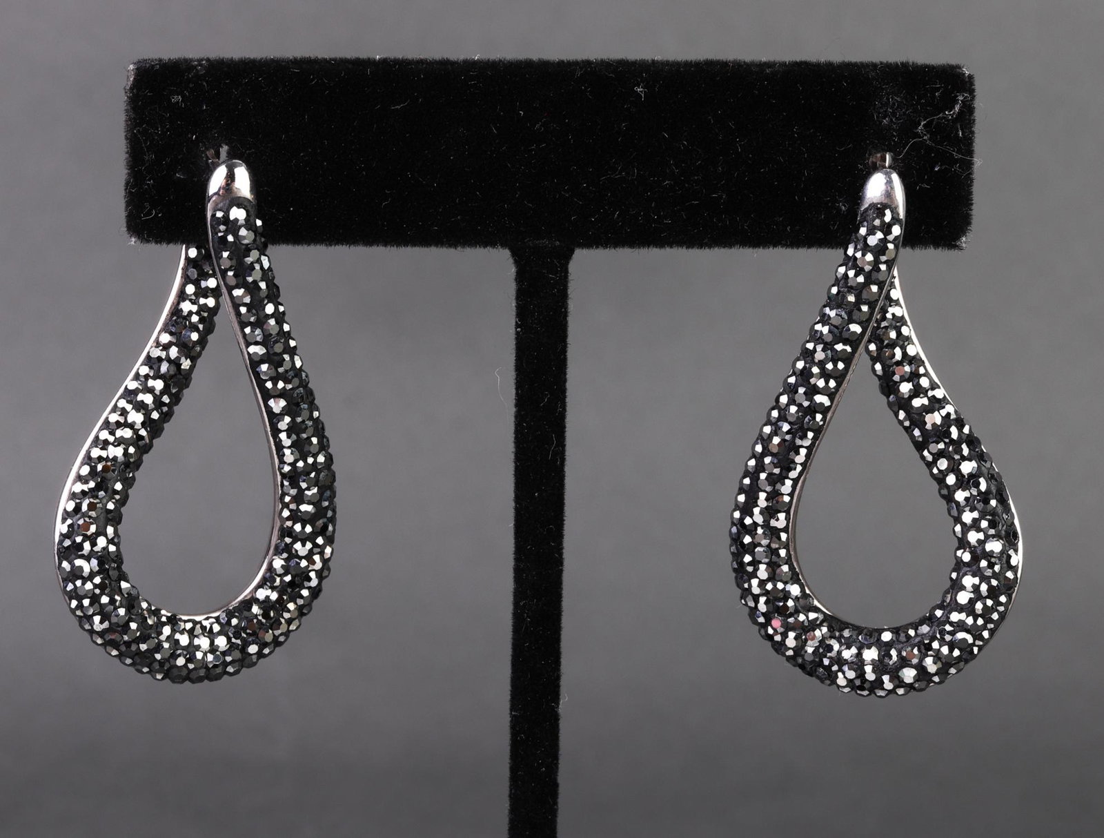 Sterling Silver & Marcasite Twist Hoop Earrings: Sterling silver and marcasite twist hoop earrings, marked: "TCN 925 Thailand." 1.5" H. Approx: 0.27 ozt (inclusive).