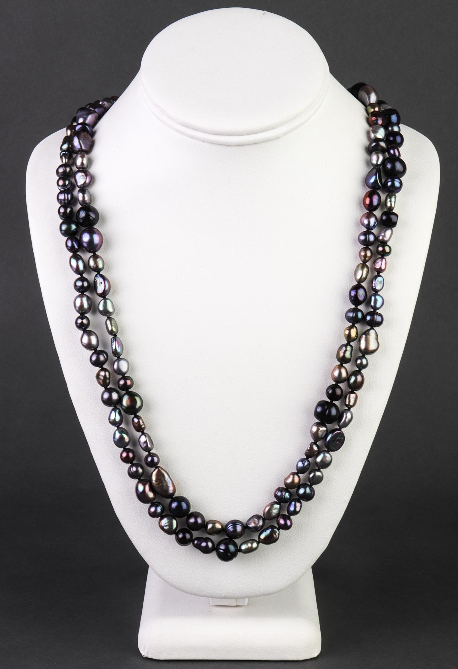 Opera Length Multi-Color Tahitian Pearl Necklace: Opera length strand of baroque Tahitian pearls in tones of grey, purple, green, and bronze, in box, 62" L.