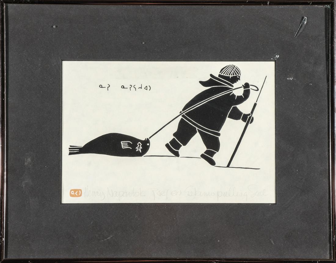Henri Napartuk Inuit Woodblock Print: Henri Napartuk Inuit woodblock print depicting Eskimo pulling seal, artist's label to reverse. Image: 6" H x 9"W; frame: 11.25" H x 14.25" W.
