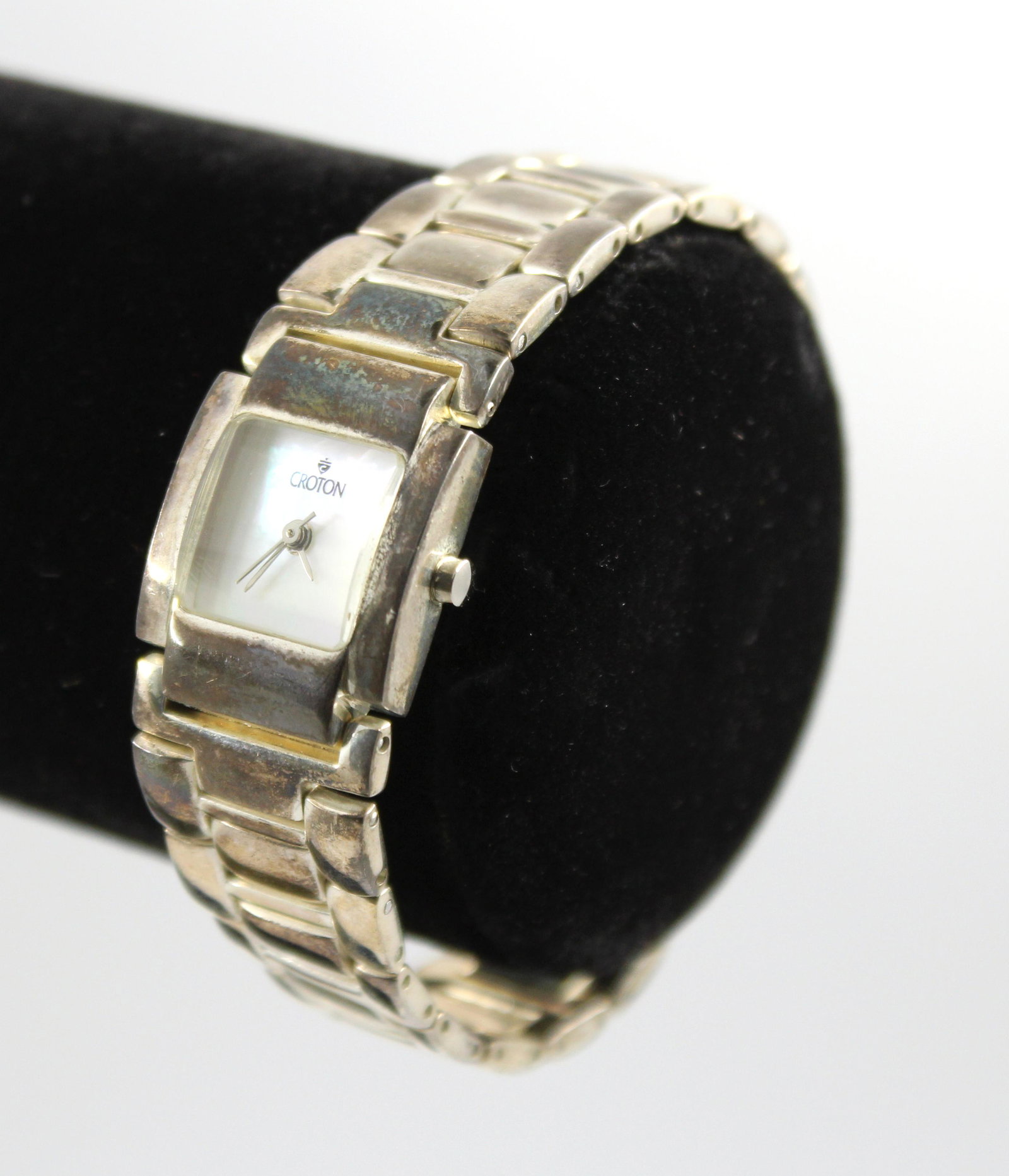 Croton Sterling Silver Ladies' Wristwatch: Croton ladies' wristwatch, mother of pearl dial, quartz, Japan movement, stainless steel backing with sterling silver case and bracelet. 7" inner diameter. Silver not weighable.