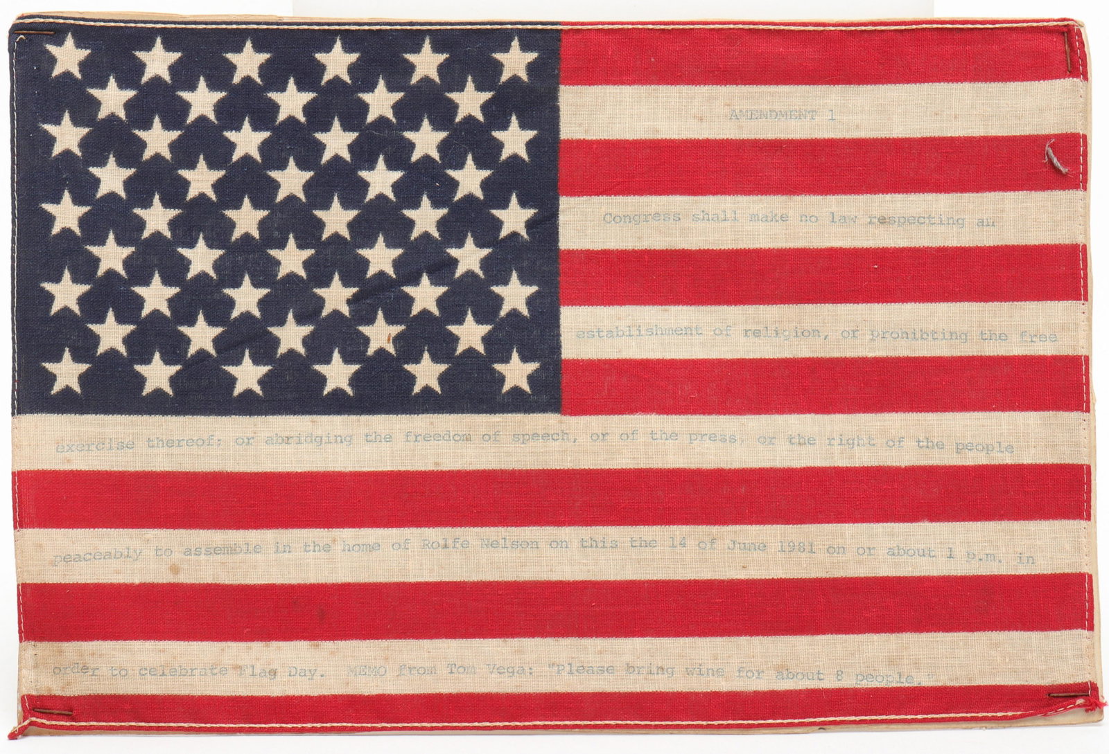 Tom Vega Pop Art American Flag: Printed cotton U.S. flag with typewritten text in white stripes "Amendment 1 / Congress shall make no law respecting an establishment of religion, or prohibiting the free exercise thereof; or abridgin
