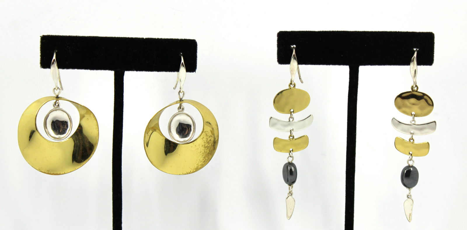 Robert Lee Morris 2 Pairs Silver & Brass Earrings: Two pairs of Robert Lee Morris designer silver and brass modern dangle earrings, one pair with polished stone element. Both marked "RLM / Studio" and "925". One pair 1.375" W x 2" L. drop, the other p