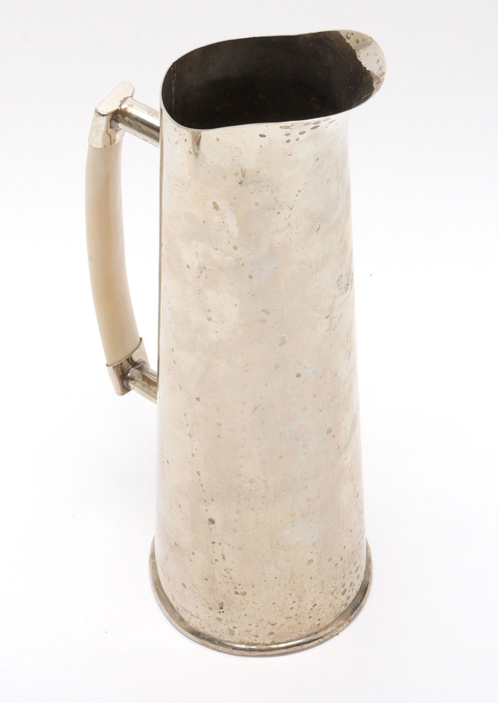 Modern Silver-Plate Pitcher with Bone Handle: Modern silver-plate pitcher with bone handle. 12" H x 4.125" diameter (base). Property from the Estate of designer, model, television host, and business woman, Nina Griscom.