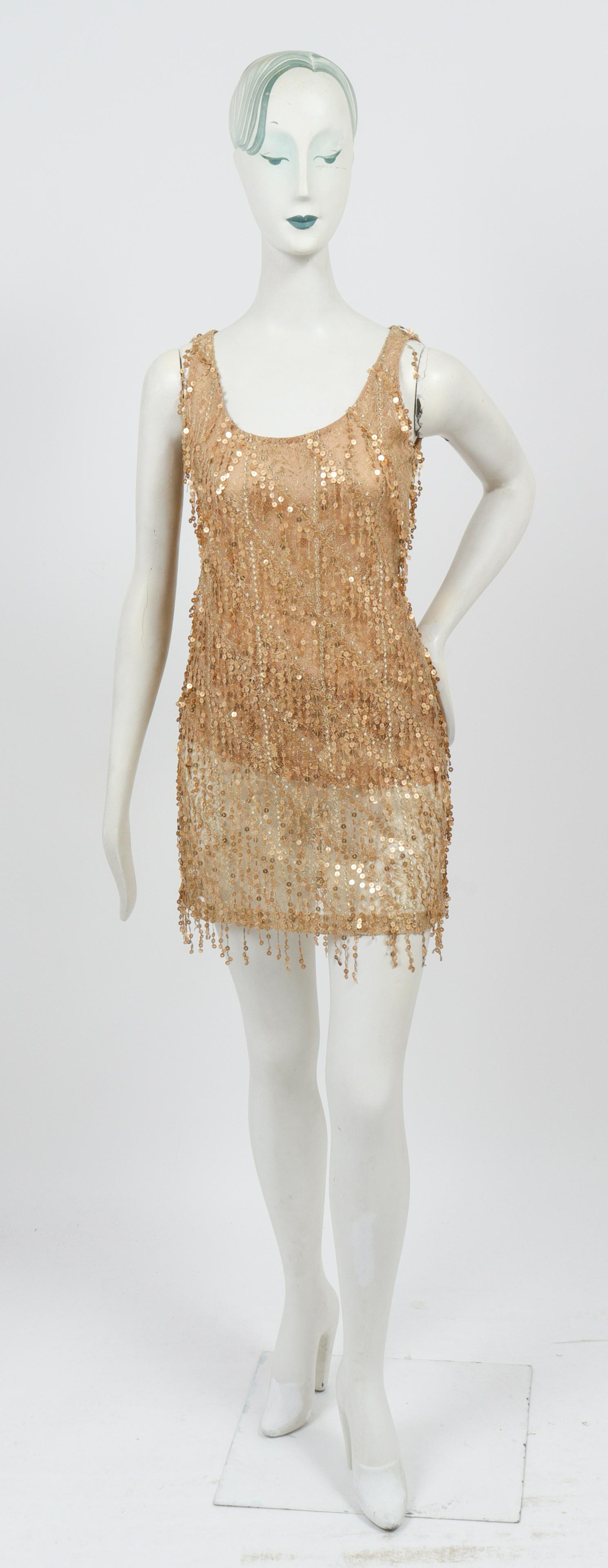 Bill Blass Sequined Mini Cocktail Dress: Bill Blass sequined mini sleeveless cocktail dress, with champagne / gold sequins fringe over lace with silk gauze lining, designer's label "Bill Blass" to interior lining, back zipper closure. Bust: