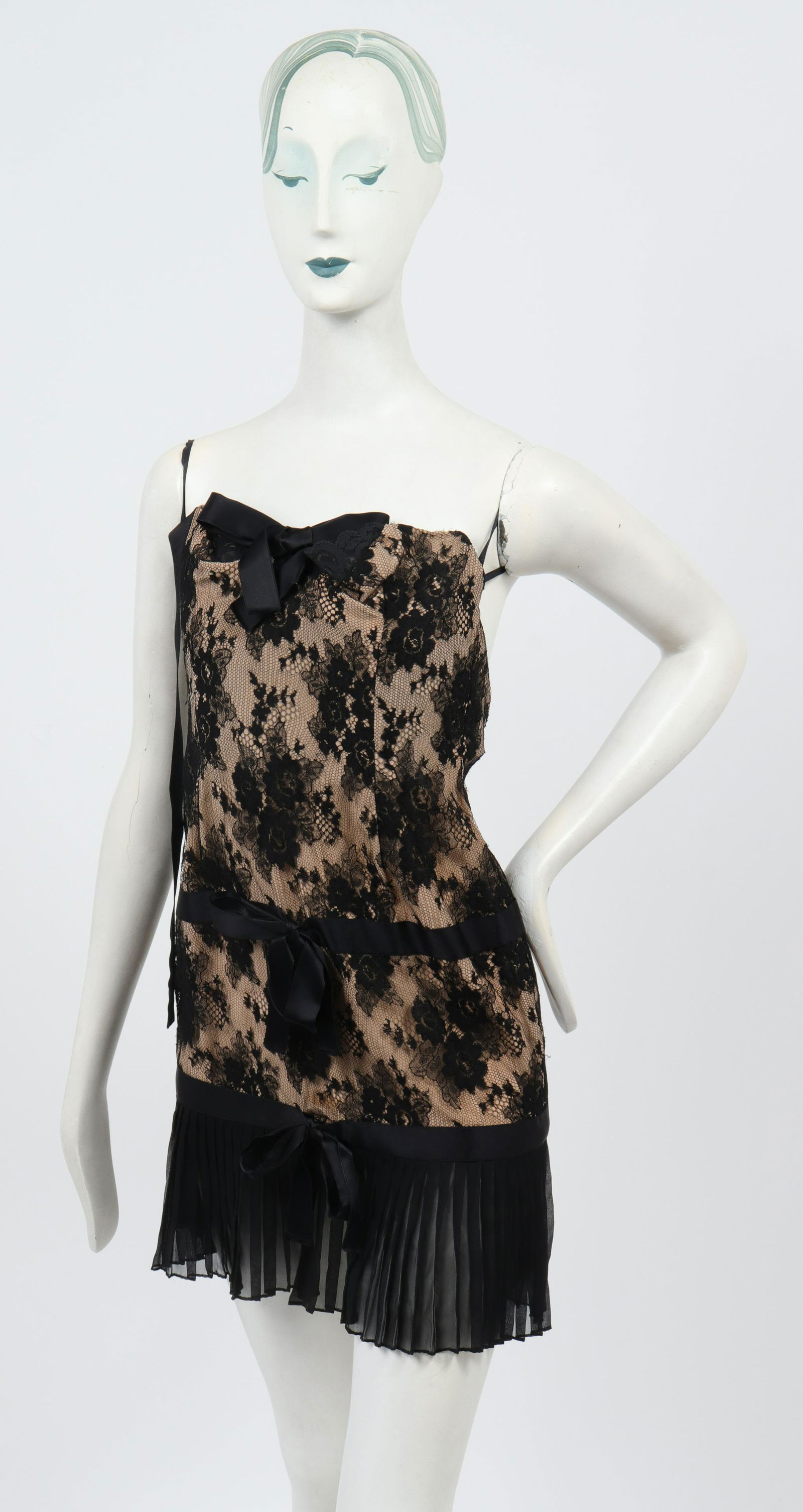 Bill Blass Attrib Lace Bustier Lingerie Dress: Petite lace bustier lingerie dress attributed to Bill Blass, with black lace over sheer nude silk gauze lining, bow details, and pleated hem, back zipper closure. Bust: 12" W; waist: 12" W; hips: 15"