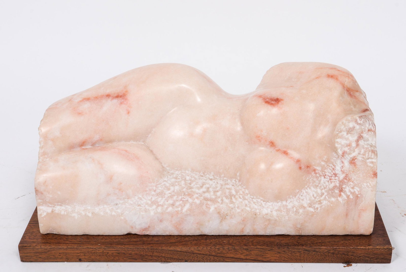 Pink Marble Reclining Nude Woman: A. Gerosa signed modern carved pink marble sculpture depicting reclining nude female torso, mounted on wood block base. Overall: 10" H x 20" W x 10" D.