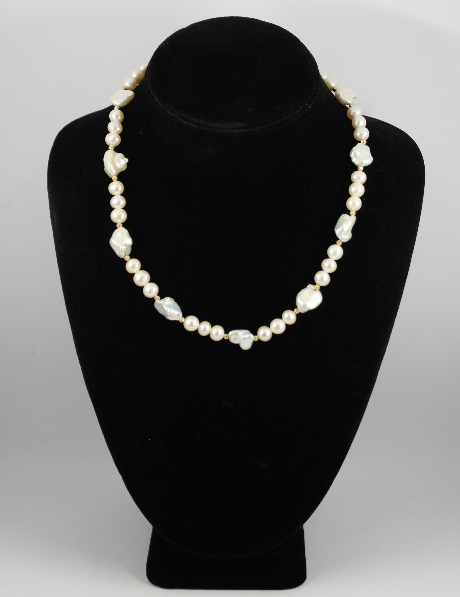 Effy Designer 14K Yellow Gold And Pearl Necklace: Contemporary Effy designer oval and baroque pearl necklace with 14K yellow gold spacer beads and lobster claw clasp, marked "Effy / 585." Gold beads approx: 3mm diameter. Oval pearls approx: 8mm diame