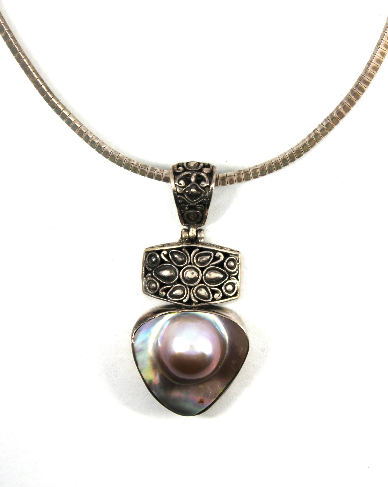 Italian Silver Tahitian MOP Pendant Omega Necklace: Italian silver ornate Tahitian mother-of-pearl pendant on omega style necklace, marked: "925 / ITALY / P.R. EX" with maker's mark. Pendant measures 2.5" L x 1.125" W at widest section. Omega necklace 