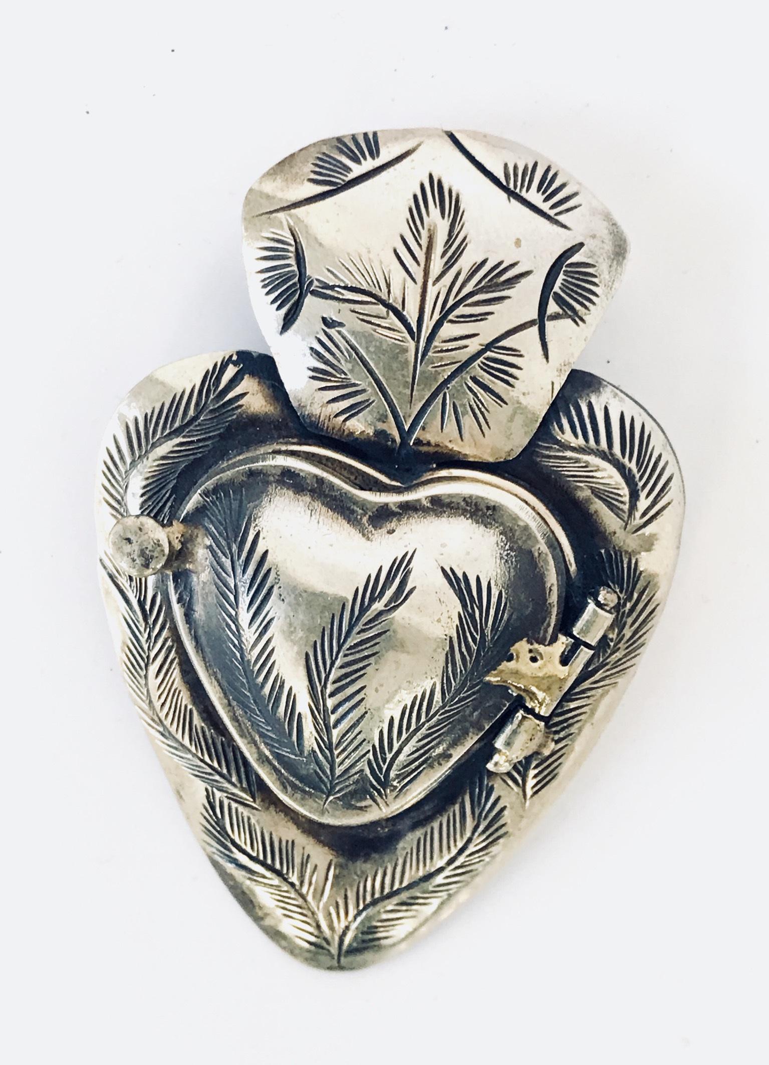 Mid-Century Silver Sacred Heart Locket Pendant: Mid-century silver Sacred Heart locket pendant. 2.5" H x 1.5" W.