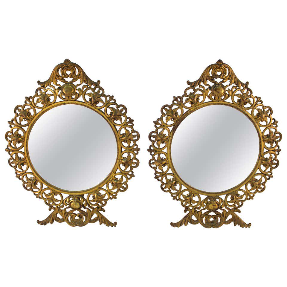 American Victorian Round Gilt Metal Table Mirrors: Pair of American Victorian round table mirrors set in gilt metal frames, circa 1890s. 14" H x 11" W x 4" D.