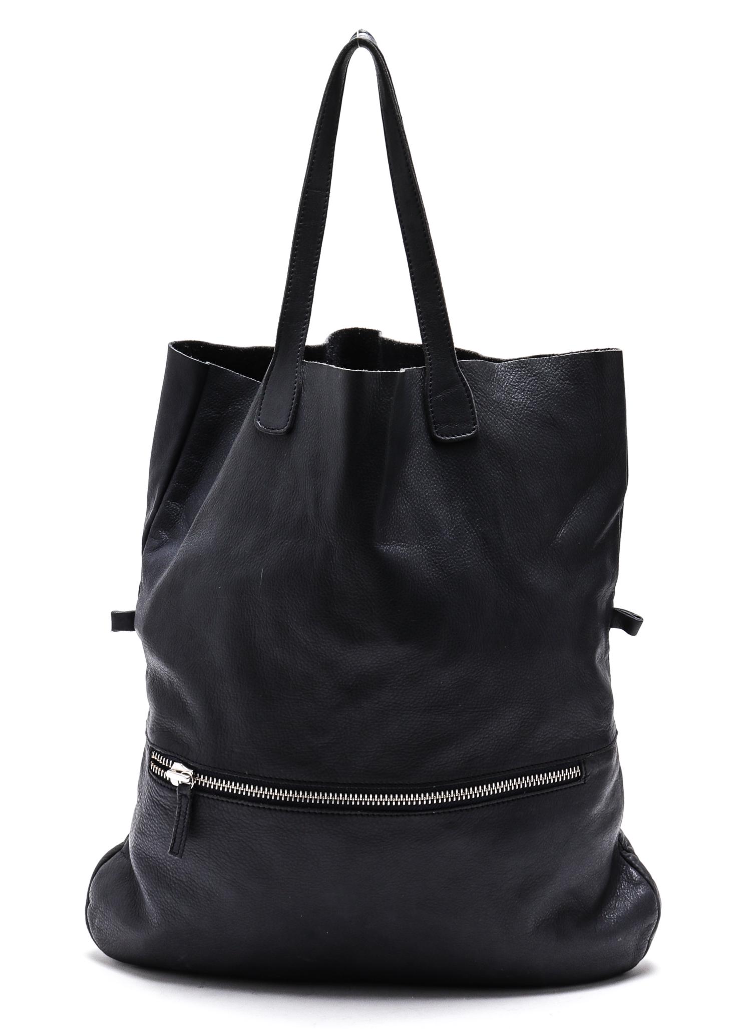 Leather Long Tote / Handbag: Leather long tote / handbag, with suede texture interior and exterior zipper compartment. 18" H x 16" W x 2" D. Light usage wear. Property from the Estate of designer, model, television host, and busi