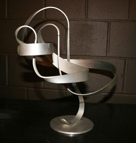Michael Cutler Aluminium Abstract Kinetic Sculptu: Aluminium Abstract Kinetic Sculpture. Rotating ribbons, on pivot points. Approximately 18" x 20", base: 7"