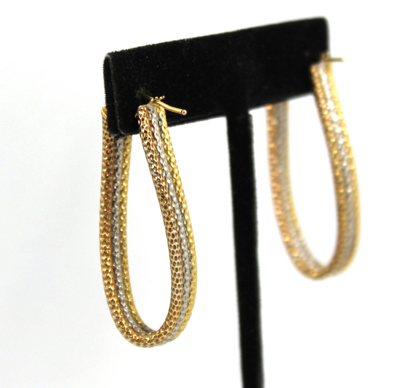 Milor Designer 14K Tri-Gold Triple Hoop Earrings: Modern Milor designer 14K yellow, white, and rose gold triple oval hoop earrings with snap down clasps, marked on terminals "Milor / 14 Kt / Italy." Drop: 1.75" L. Approx: 3.5 dwt.