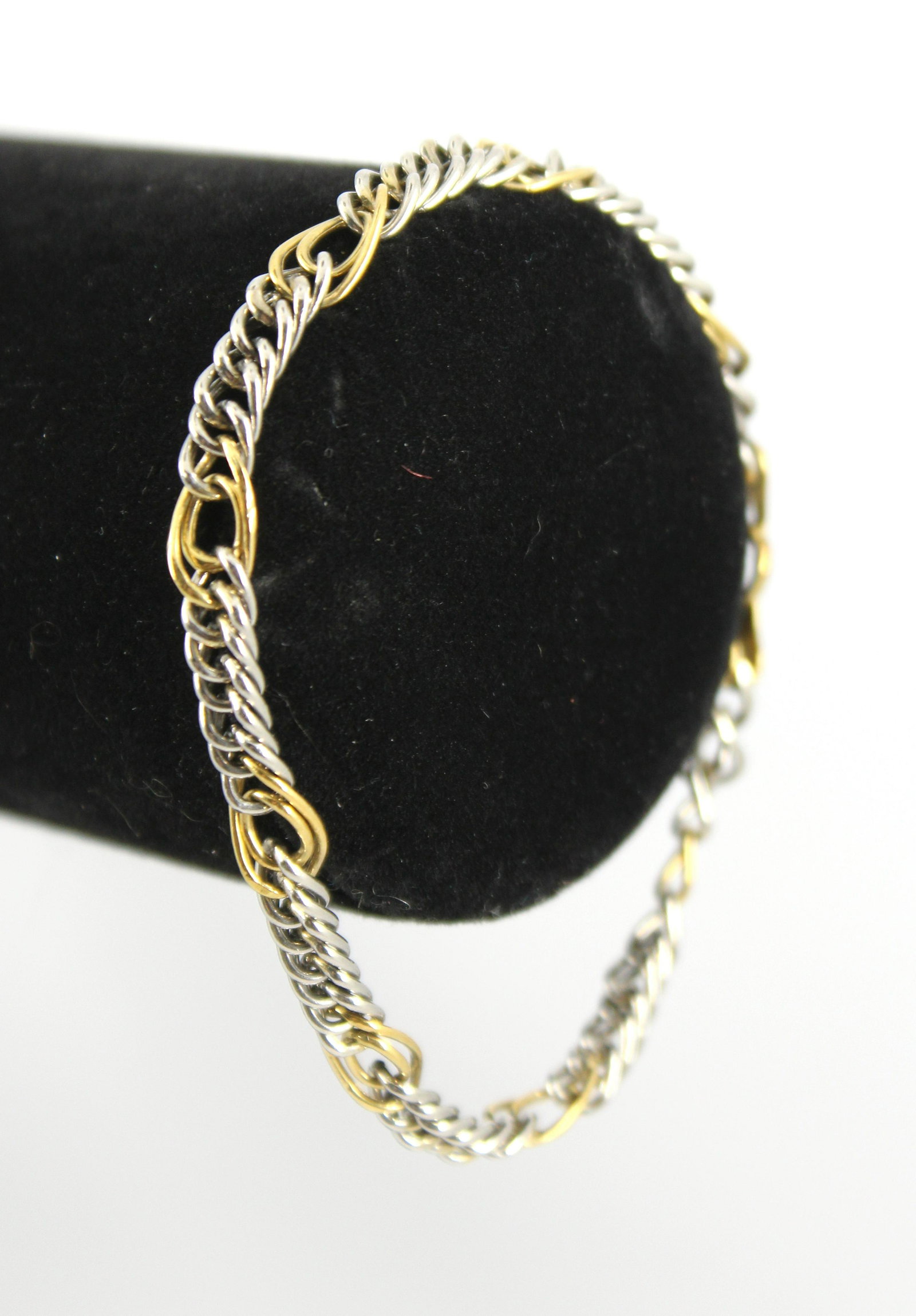 Modern Platinum & 18K Yellow Gold Bracelet: Modern chain bracelet with platinum links interspersed with 18K yellow gold accents and terminals joined with a closed gold link (no clasp), marked "950" and 18Kt." Internal circumference: 7.125" L. x