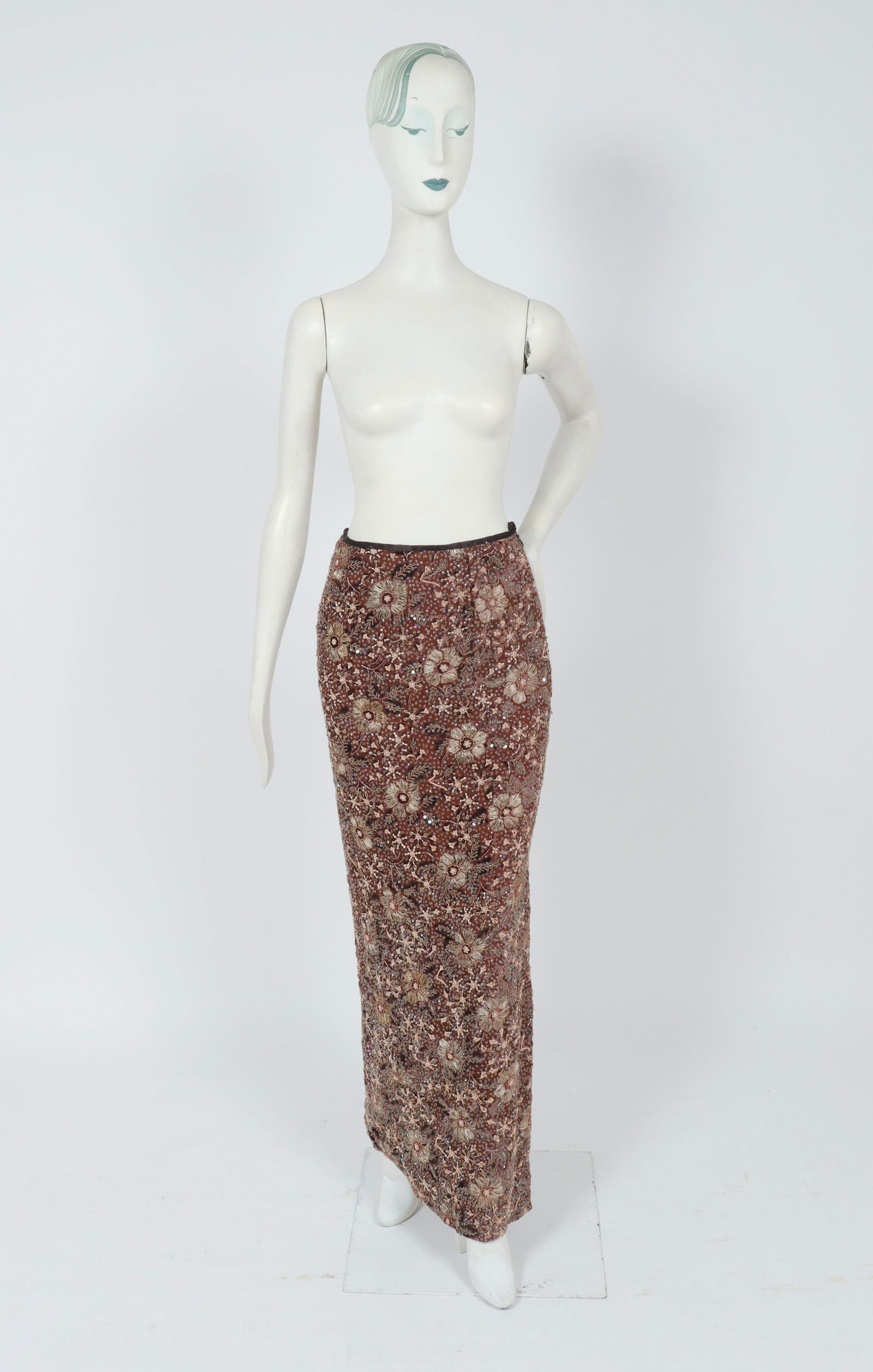 Bill Blass Attrib. Embroidered Evening Skirt: Bill Blass attributed floral embroidered and sequined evening maxi skirt with velvet details, side zipper and side slit. Waist: 12.5" W; hips: 16" W; length to bottom hem: 42" L. Property from the Est
