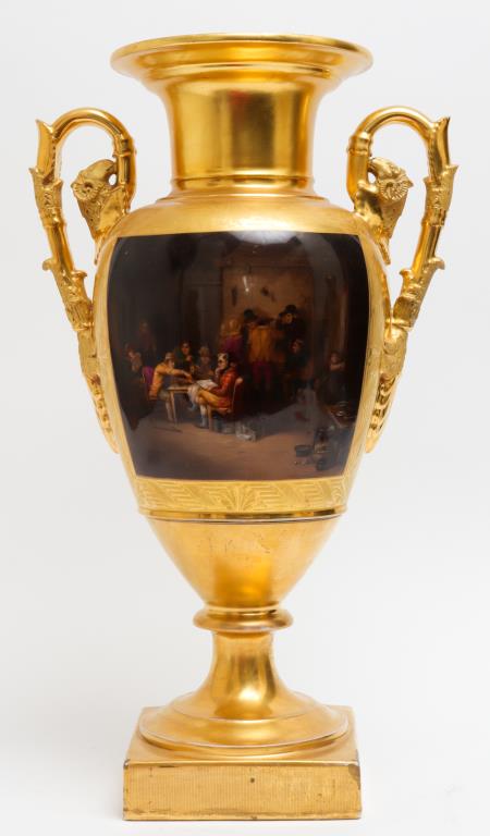 Gilt Porcelain Mantel Urn w Genre Scene: Continental gilt porcelain mantel urn, with hand-painted Northern European style genre scene on one side, landscape on the other, ram's heads on handles, bearing spurious Meissen mark underside. 17.75