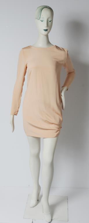 Bill Blass Long Sleeve Cocktail Dress: Bill Blass long sleeve cocktail dress with ruched detail to the side, zippered back, and designer's label "Bill Blass" to interior. Shoulders: 16" W; armpits: 18.5" W; waist: 17" W; length to bottom h