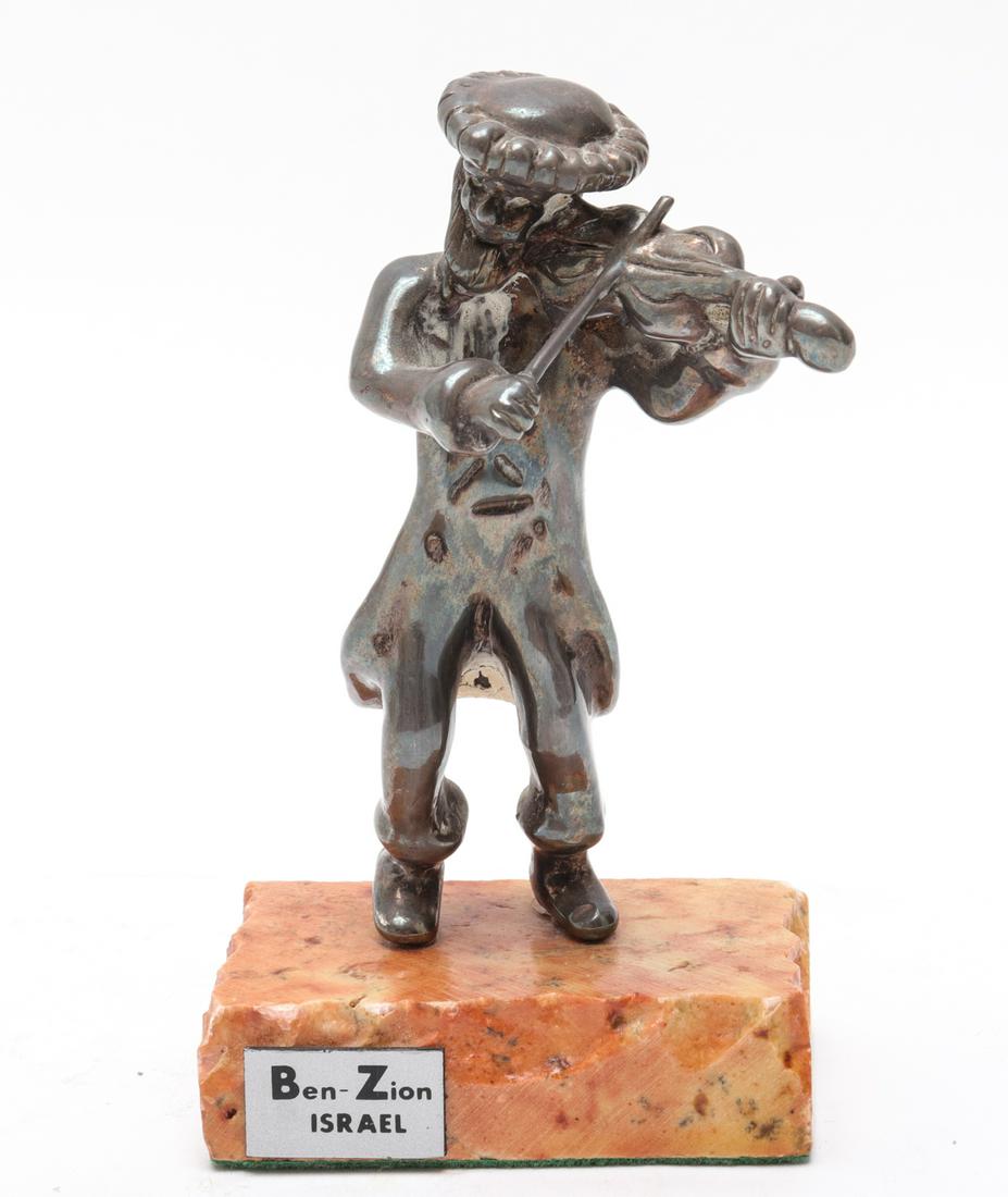 Judaica Ben-Zion Silver Orthodox Fiddler Sculpture: Judaica Ben-Zion sterling silver Orthodox Jewish fiddler sculpture mounted on a stone base with applied label "Ben Zion / Israel," marked "925." Sculpture 3.875" H. x 1.875" W. x 1.875" D. Base 0.625"