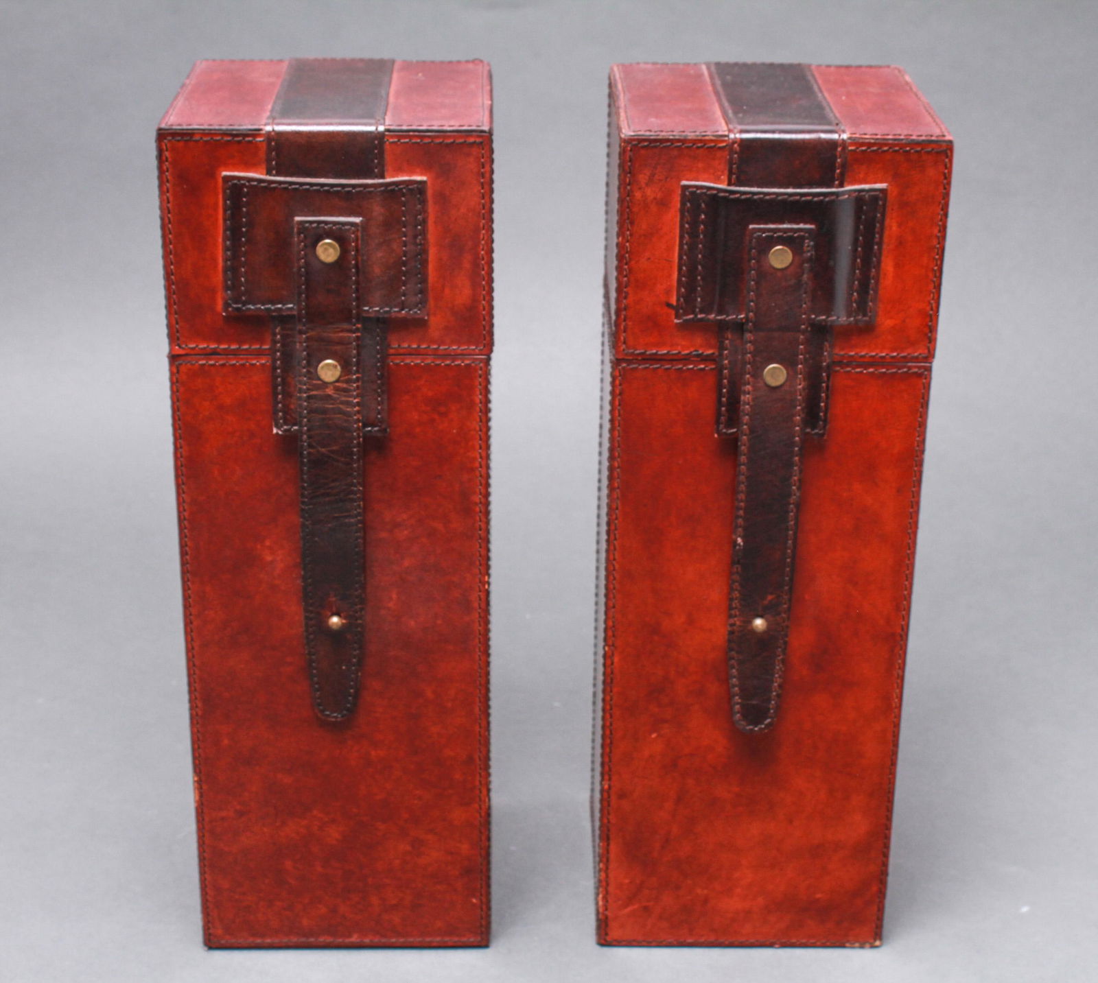 Windermere Leather Wine Boxes, Group of 2: Group of two Windermere leather wine boxes with leather strap and brass studs, embossed logo underneath: "Windermere." 14.5" H x 5" square. Minor scuffs.
