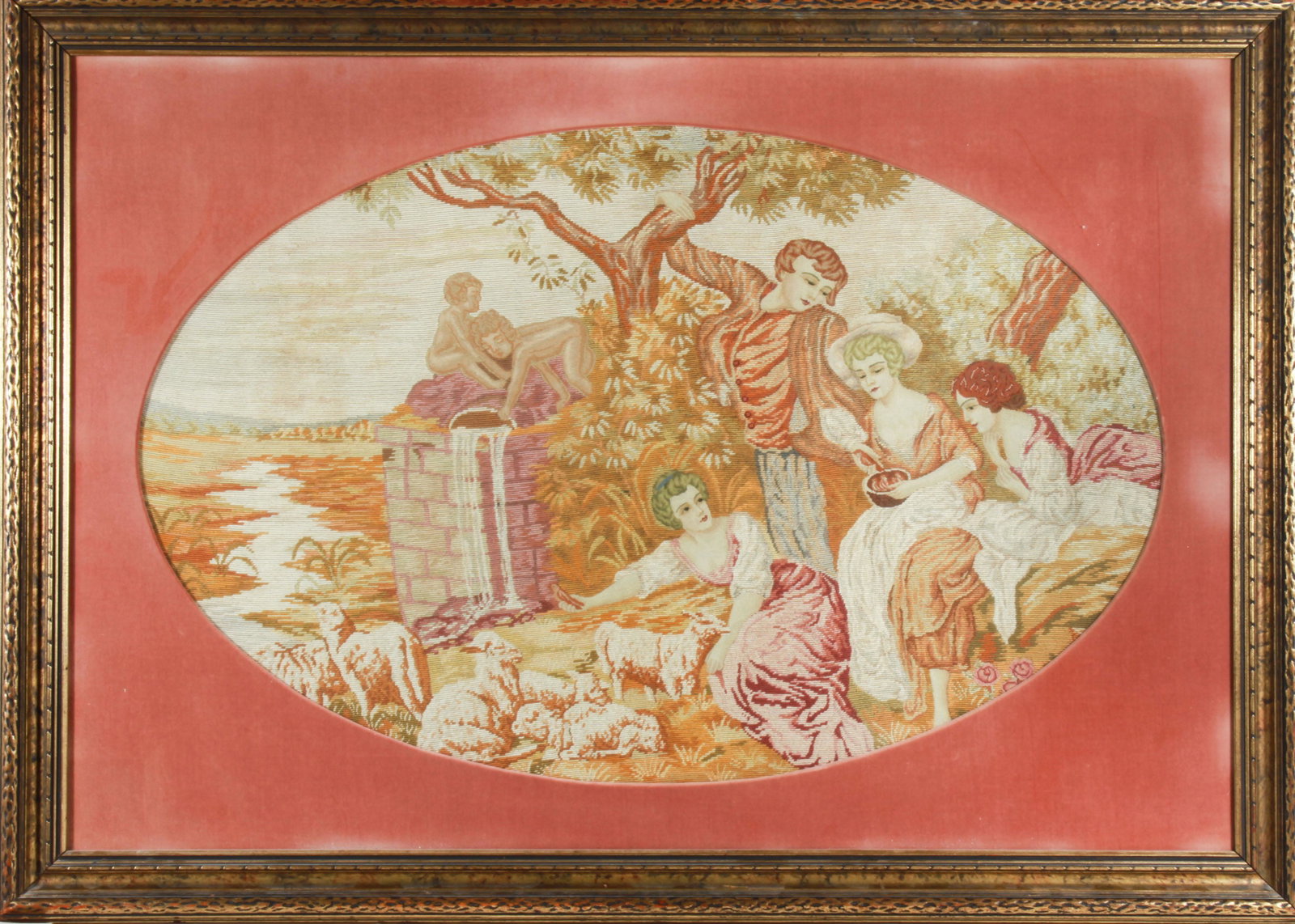 French Rococo Style Needlepoint of Pastoral Party: French Rococo style needlepoint, depicting a pastoral scene of figures beside a well with lambs and putto. Image 27" H x 42.5" W; frame 39" H x 54" W. Fading of color to velvet matting.