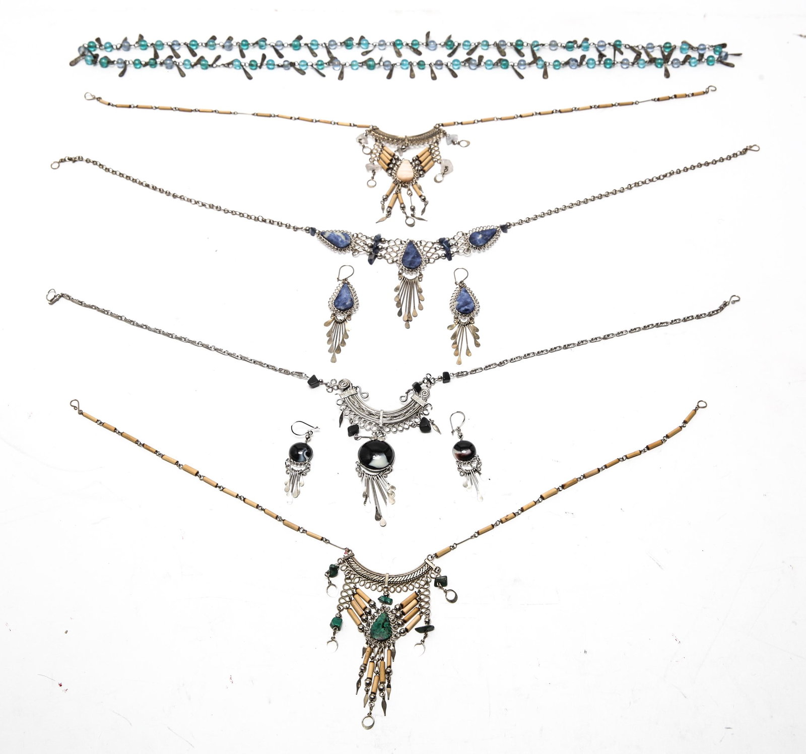 Tribal Inspired Jewelry, Woman's, 7 Pcs: Tribal inspired woman's jewelry pieces, seven pieces, consisting of five glass, malachite, sodalite, and cream agate necklaces and two pairs of dangle earrings. Largest 17" L.