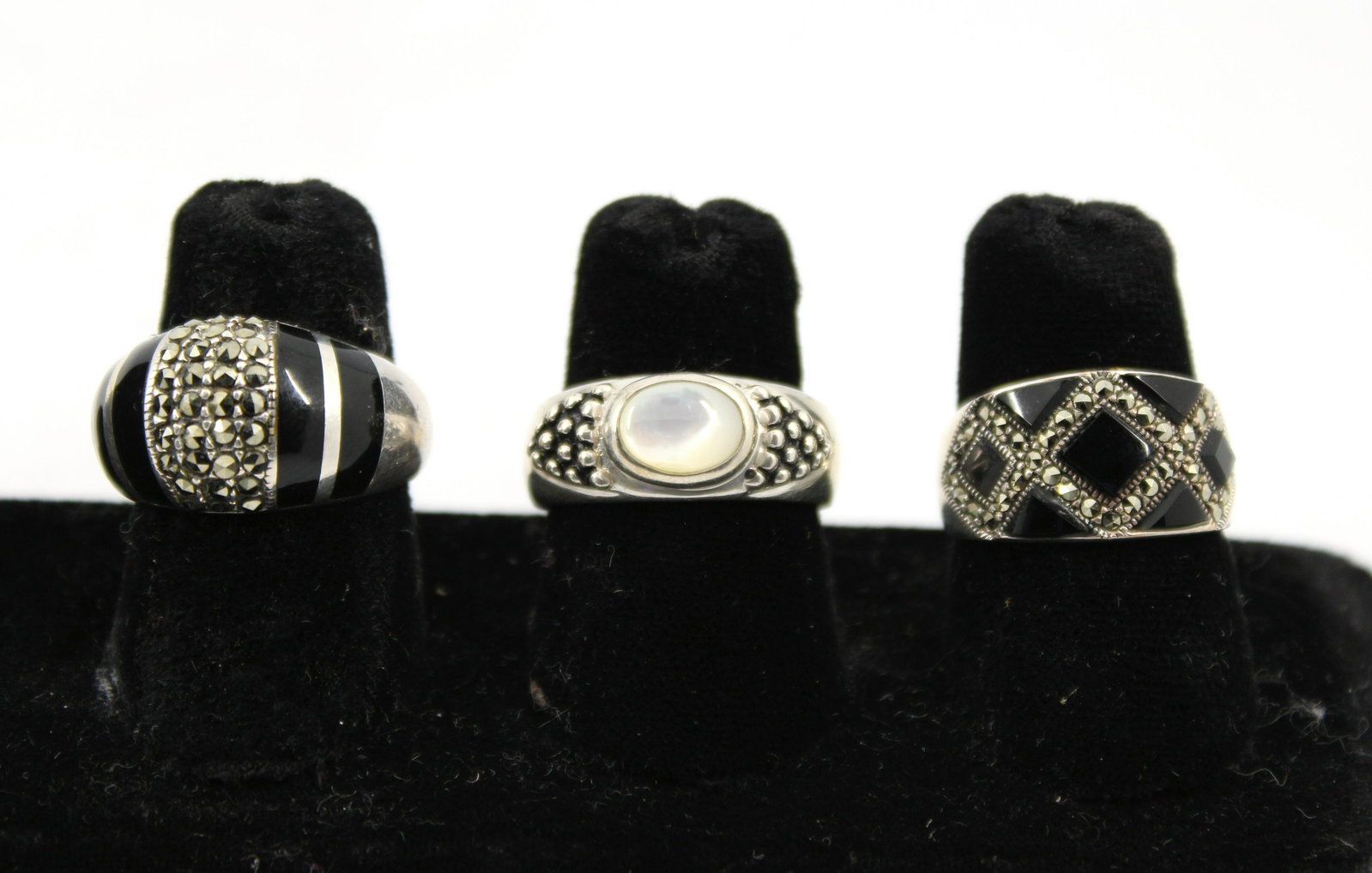 Joseph Esposito & Other Silver Rings, 3: Three sterling silver rings, including a Joseph Esposito ring with mother-of-pearl, stamped "925 / ESPO / Ster," and two rings with onyx and marcasite, one stamped "925 Thailand," the other stamped "N