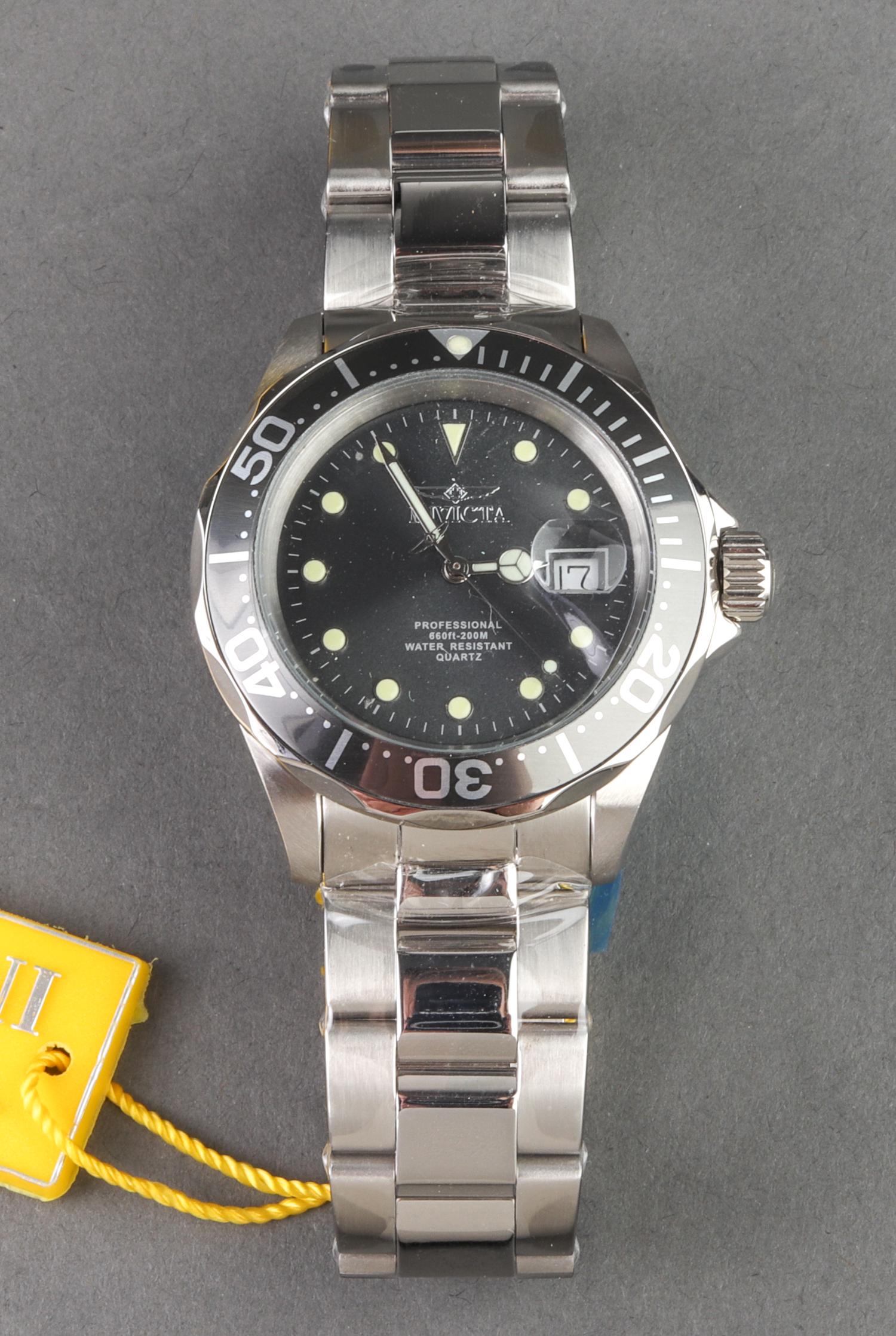 Invicta "Pro Diver" Stainless Steel Watch #17055: Invicta "Pro Diver" stainless steel wristwatch, model number 17055, water resistant 200m, black dial and bezel, Arabic numerals, signed on dial and case reverse, stainless steel bracelet, with hinged