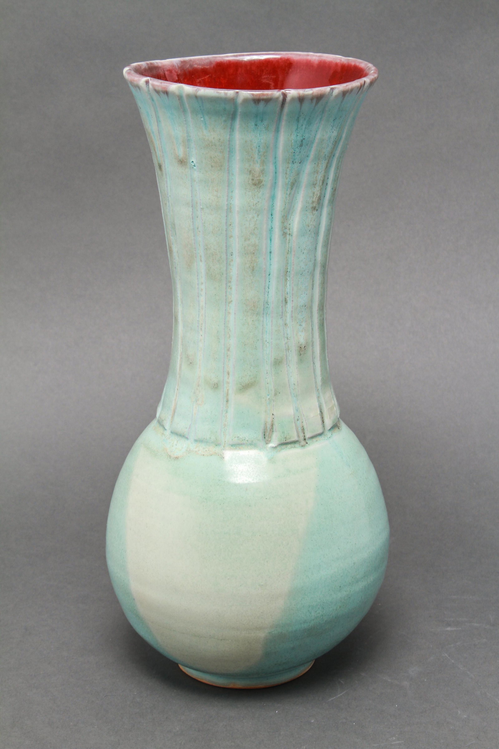 Art Pottery Turquoise & Ox-Blood Porcelain Vase: Art pottery turquoise with ox-blood interior glazed porcelain vase, signed illegibly underneath. 12.25" H x 5.5" diameter.
